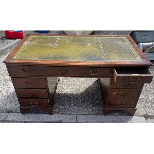 88 - A mahogany pedestal desk with green leather top