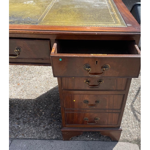 88 - A mahogany pedestal desk with green leather top