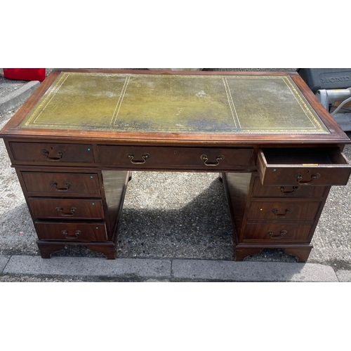 88 - A mahogany pedestal desk with green leather top