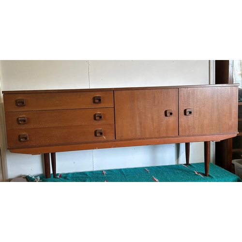 9 - A Mid Century teak sideboard, three drawers and a two door cupboard (H74cm W174cm D44cm)