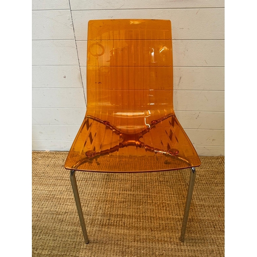 90 - Three Frovi coloured perspex chairs with chrome frames, two green and one orange