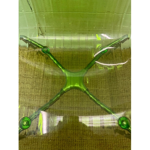 90 - Three Frovi coloured perspex chairs with chrome frames, two green and one orange