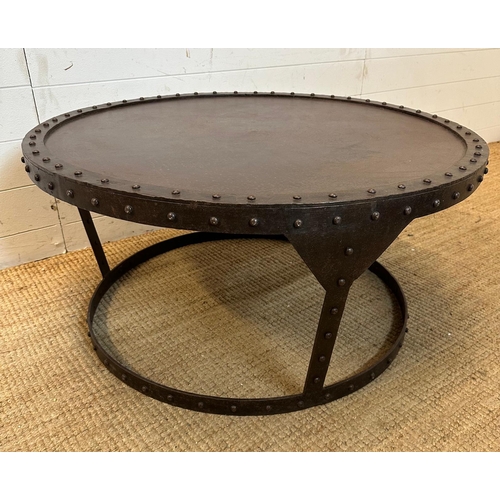 91 - A circular industrial style coffee table with rivet detail and a raised rim (H43cm Dia91cm)