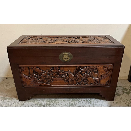 103 - A camphor wood trunk with oriental carvings to sides and tops AF (H60cm W100cm D51cm)