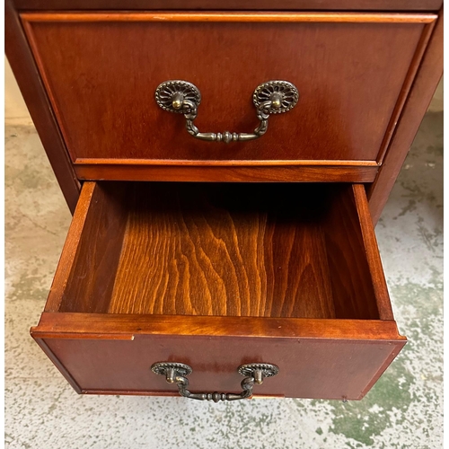 104 - A green leather topped pedestal desk, a long central drawer flanked by four short drawers and a cupb... 