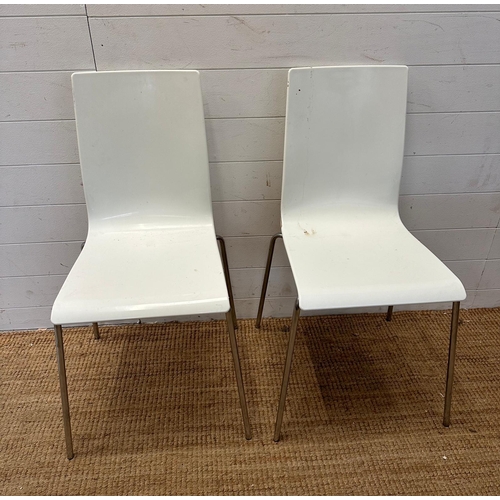 114 - Two white Italian Sintesi chairs on chrome legs