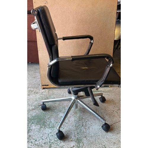 118 - An Eames style leather office chair