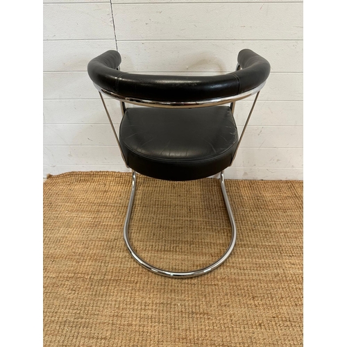 120 - A tubular chrome Bauhaus style chair in a faux black leather upholstery