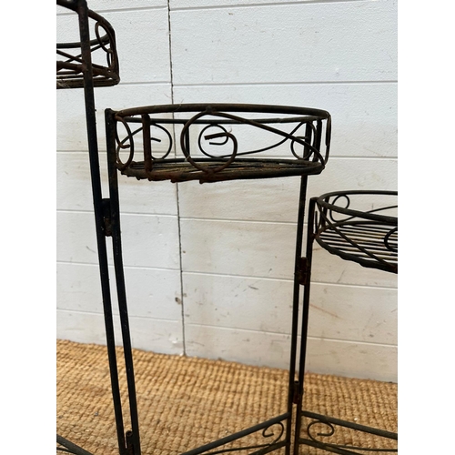 129 - A three tier wrought iron foldable plant stand