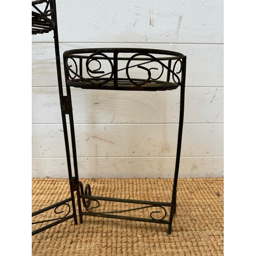 129 - A three tier wrought iron foldable plant stand