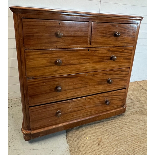 13 - A mahogany chest of drawers with knob handles (H124cm W119cm D52cm)