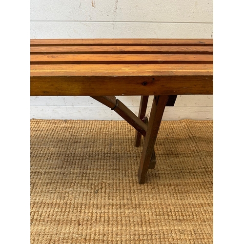 130 - A vintage pine collapsible slatted bench (H45cm W213cm)