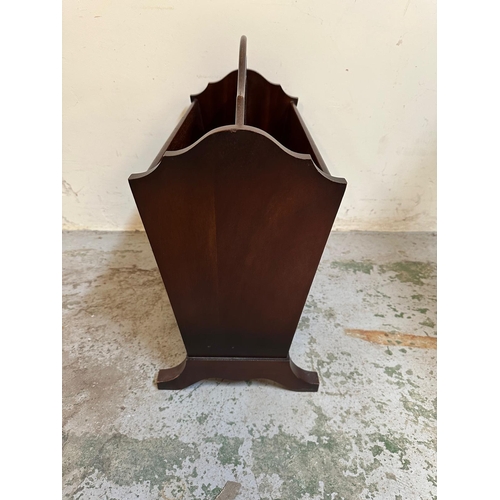 138 - An Edwardian style mahogany magazine rack