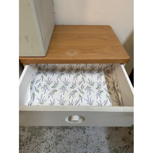 141 - A pair of grey pine topped three drawer bedside tables by Stag and a matching laundry bin (H63cm W57... 