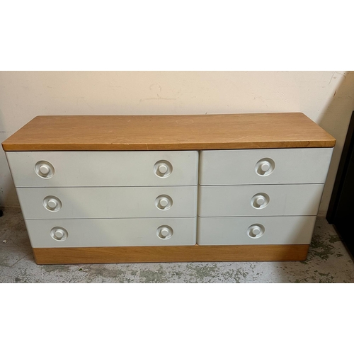 142 - A grey pine topped chest of drawers by Stag comprising of three long drawers and two adjacent shorte... 