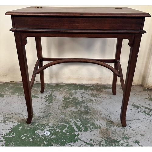 152 - A mahogany ladies desk or writing table with hinged lid opening to black leather writing surface and... 