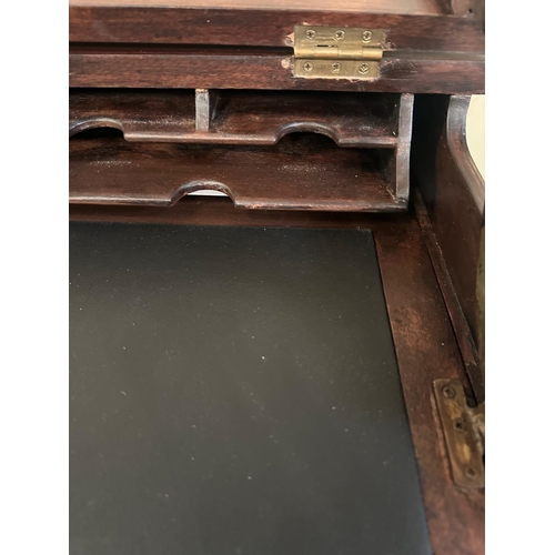 152 - A mahogany ladies desk or writing table with hinged lid opening to black leather writing surface and... 