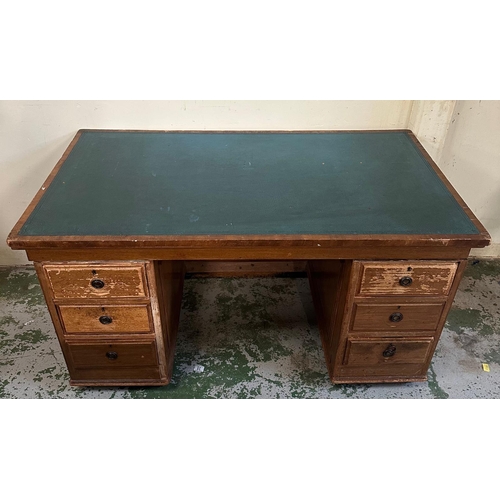 154 - A vintage oak green leather top pedestal desk with six drawers (H73cm D77cm W138cm)