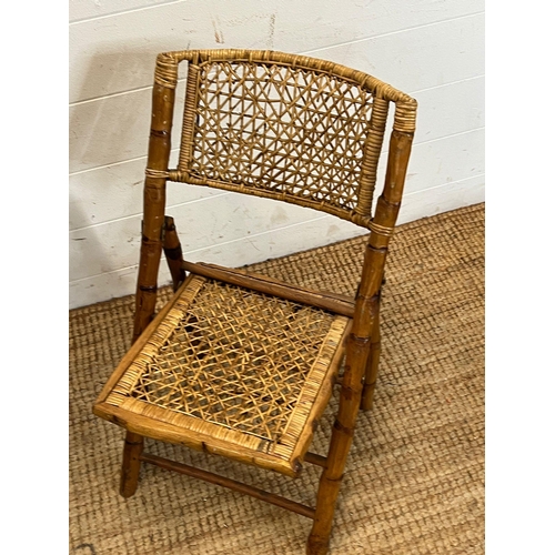 18 - A folding vintage bamboo and wicker chair