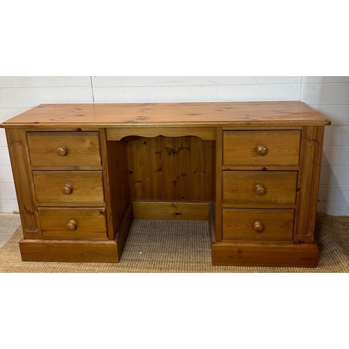22 - A pine dressing table flanked on both side with three drawers either side (D44cm W154cm H76cm)
