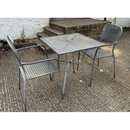 239 - A metal starburst garden table and two chairs (H73cm SQ70cm)