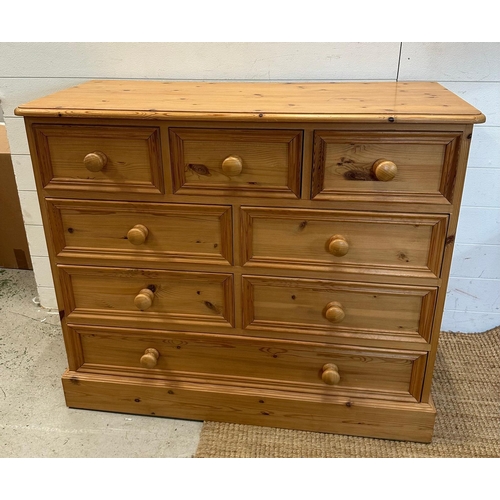 25 - A pine eight drawer chest of drawers (H87cm W101cm D44cm)