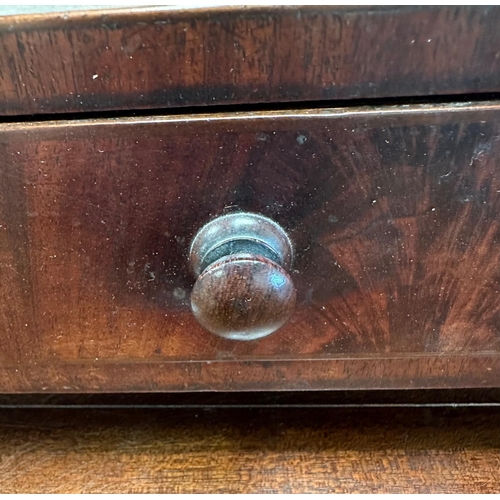 28 - A mahogany dressing table or toilet mirror with two drawers under on bun feet