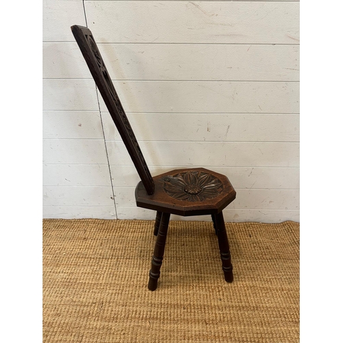 33 - An oak spinning chair with floral back and seat on turned legs