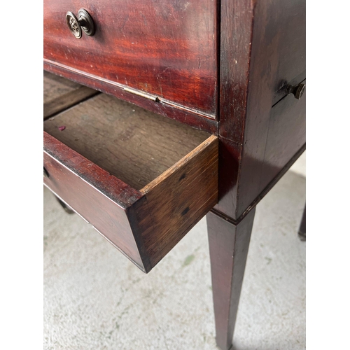 60 - A mahogany desk on tapering legs (H84cm W84cm D62cm)