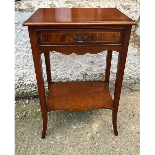 67 - A side table with drawer centre on out swept legs (H68cm W44cm D30cm)