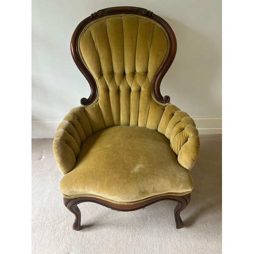 72 - A salon chair with button back and scrolling mahogany frame