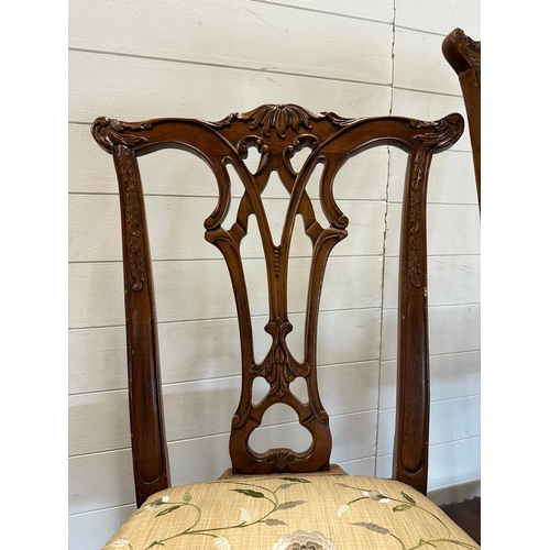 82 - An Edwardian style mahogany extending dining table on claw and ball feet and eight chairs to include... 