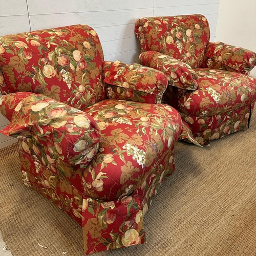 91 - A pair of swivel arm chairs upholstered in a red ground fruit tree fabric