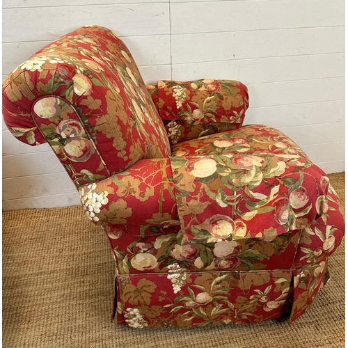 91 - A pair of swivel arm chairs upholstered in a red ground fruit tree fabric