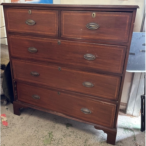 98 - A mahogany two over three chest of drawers on bun feet and brass handles (H117cm W107cm D52cm)