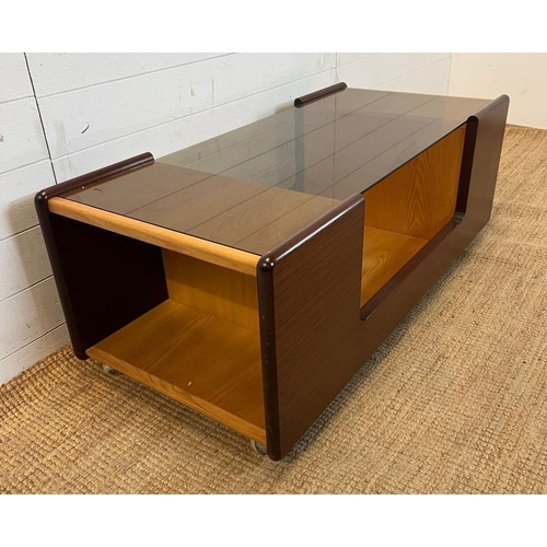 149 - A mid century coffeee table with smoked glass top. height 46 120x57