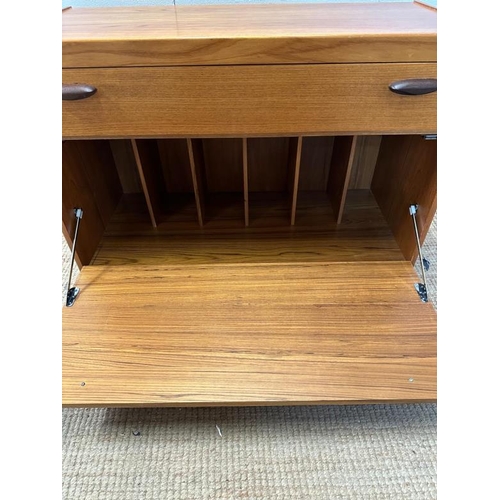 15 - A Mid Century record unit, one long drawer over hinged record cabinet