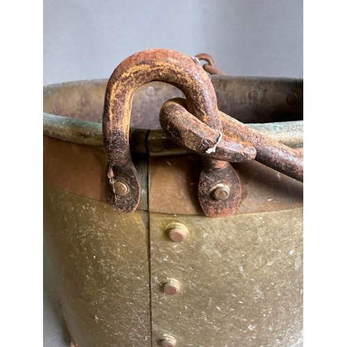 161 - A brass and copper barrel coal bucket with rivet details