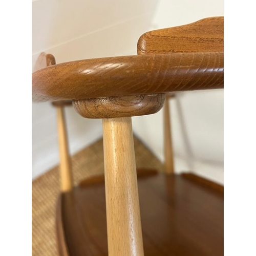 23 - An Ercol Windsor light elm three tier trolly with lipped edges (76cm x 66cm x 42cm)