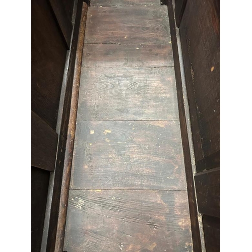 3 - A dark oak mule chest with carved panels and drawers, hinged lid opening to storage with two drawers... 