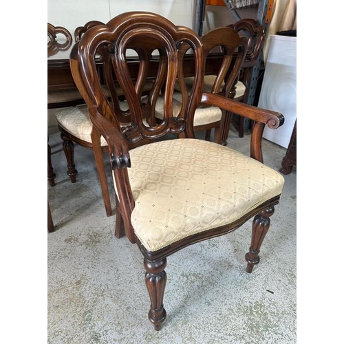 38 - A mahogany extendable dining table on turned and reeded legs ending in castors with six chairs and t... 