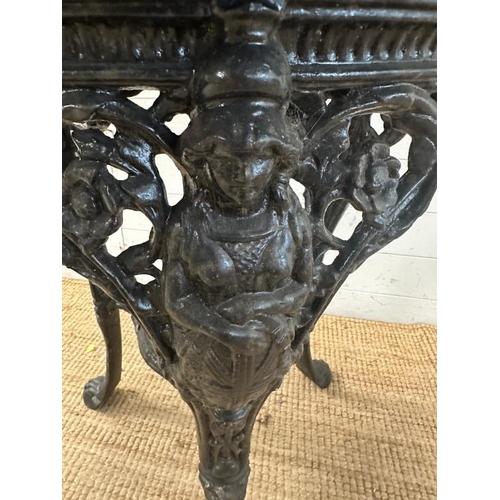 4 - A vintage black painted circular cast iron pub table with a wooden top (H75cm Dia68cm)