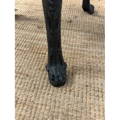 4 - A vintage black painted circular cast iron pub table with a wooden top (H75cm Dia68cm)