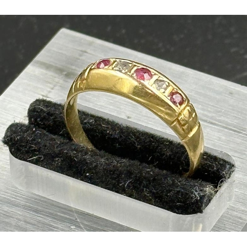 493 - An 18ct gold diamond and ruby ring, Birmingham hallmark. Approximate total weight 2.5g