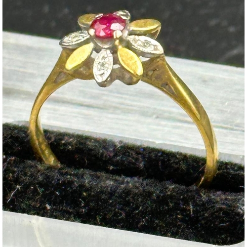 497 - A ruby , diamond and 18ct gold daisy style ring, approximate weight 2.4g