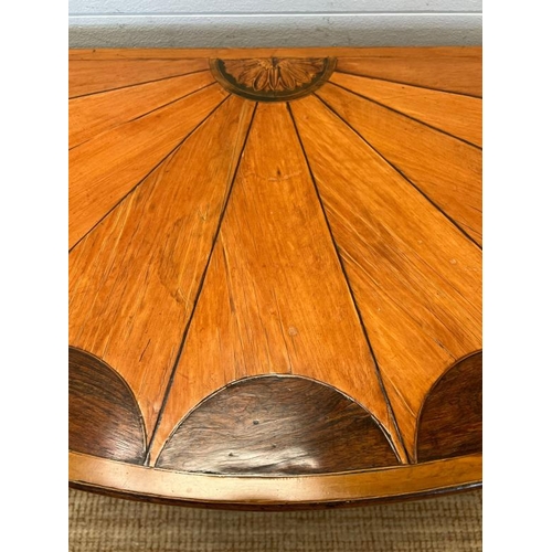 55 - A Demi Lune side table with veneered top on tapering legs (H73cm W130cm D47cm)