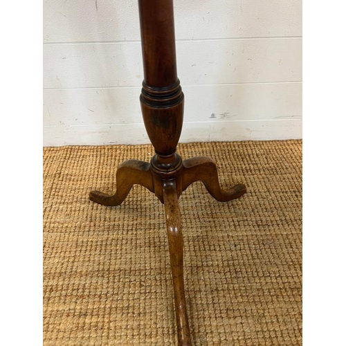 57 - An oak tripod occasional table (H70cm Dia60cm)