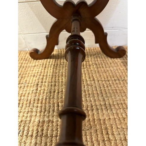 79 - A walnut framed foot stool on an ornately carved X frame with turned stretcher