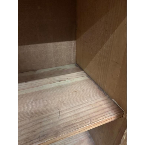 9 - A large arts and crafts pine kitchen storage cupboard, two over two door cupboards with a total of f... 