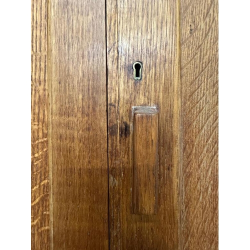 9 - A large arts and crafts pine kitchen storage cupboard, two over two door cupboards with a total of f... 